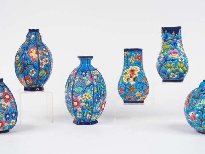LONGWY.  6 vases en émaux polychromes à décor de fleurs.
