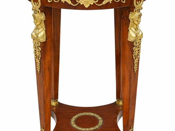 Guéridon de style Empire, en acajou et placage d'acajou, riche ornemen