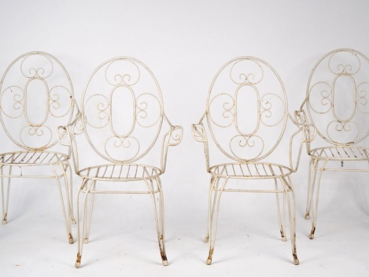 4 fauteuils de jardin 1900 en fer forgé et laqué blanc.